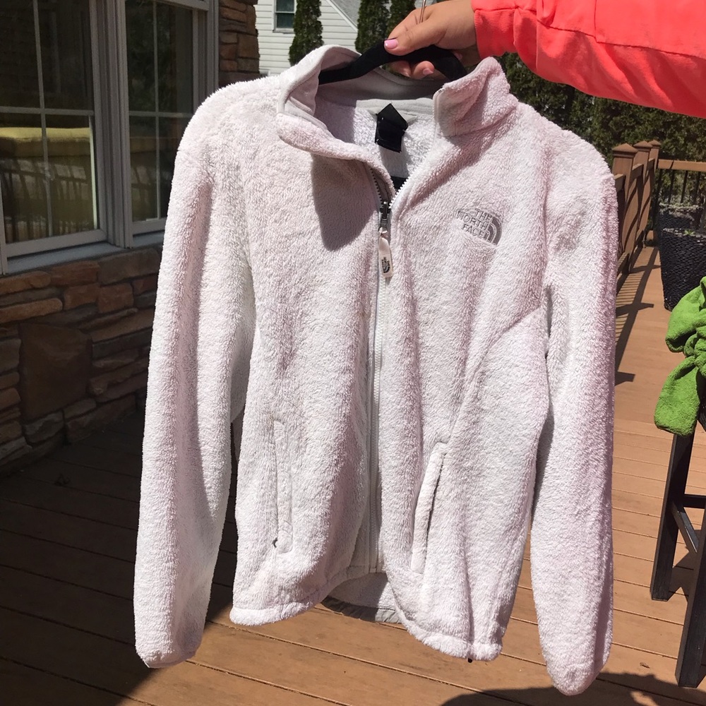 White fuzzy North Face jacket